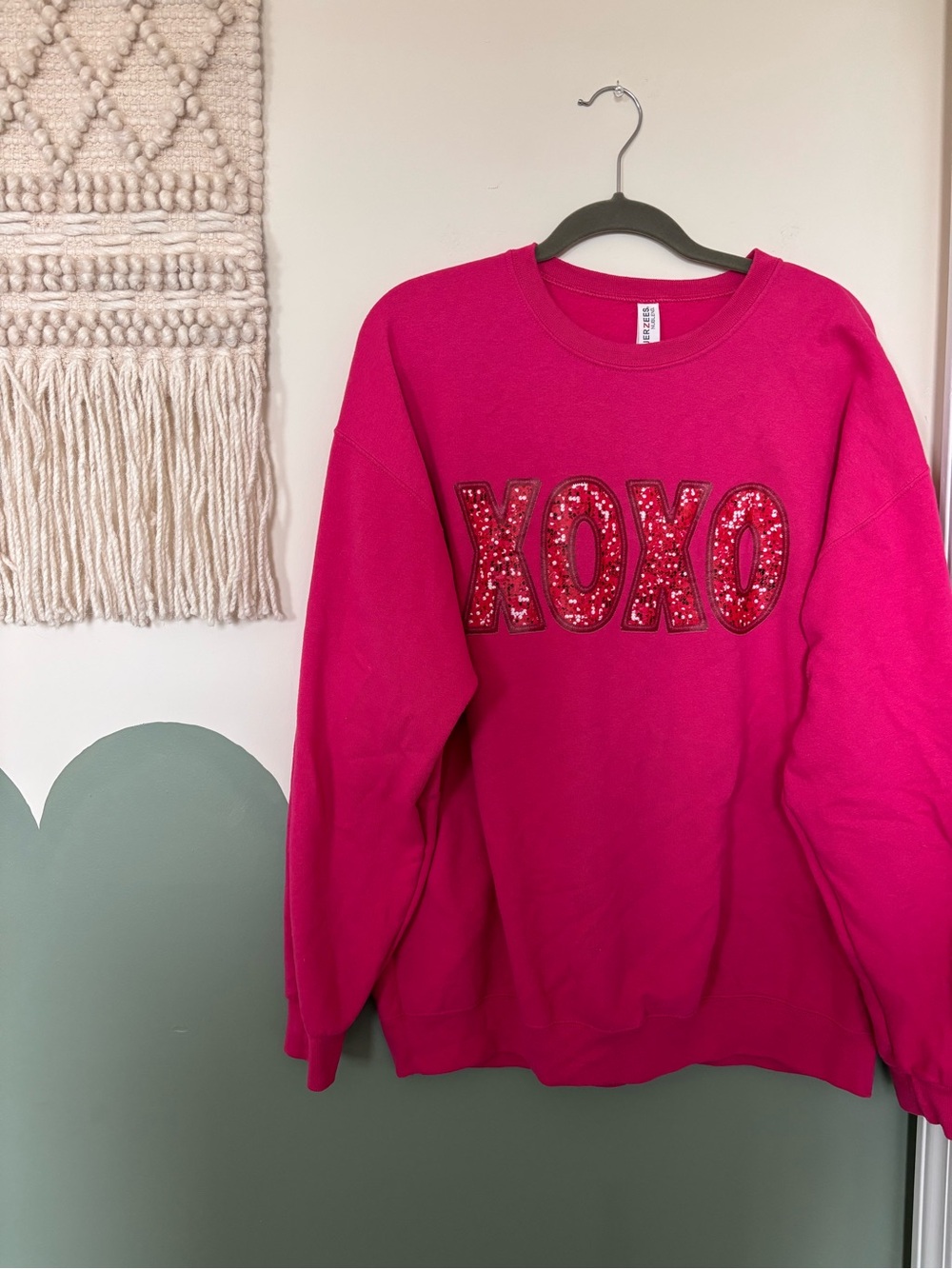 Pink XOXO sweatshirt with red letters